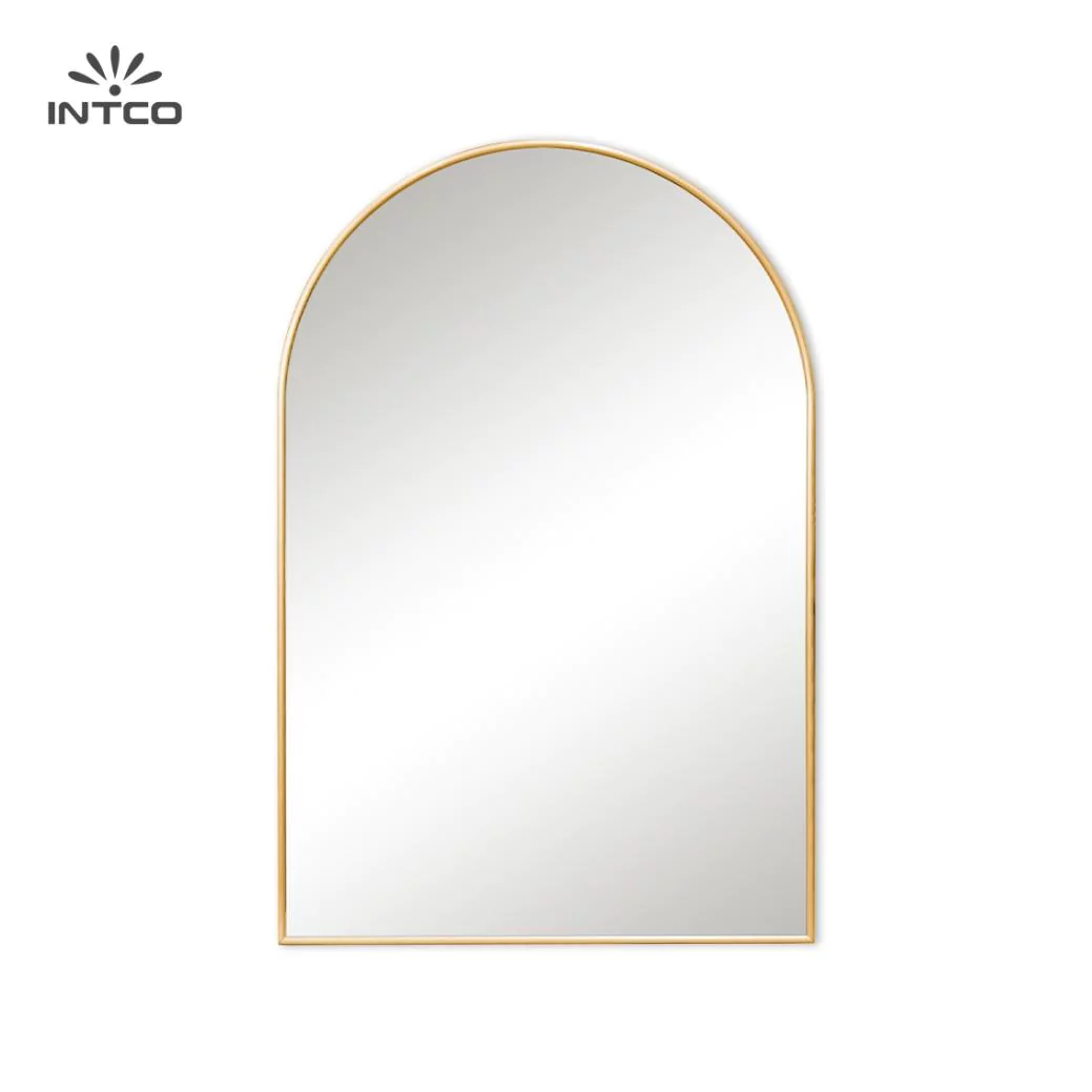 The material and style of a wall mirror can drastically influence the room's aesthetic.